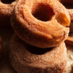 Apple cider donuts coated in cinnamon sugar