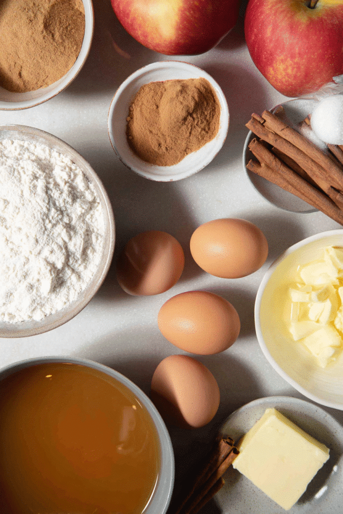 Ingredients for apple cider donuts on a kitchen counter