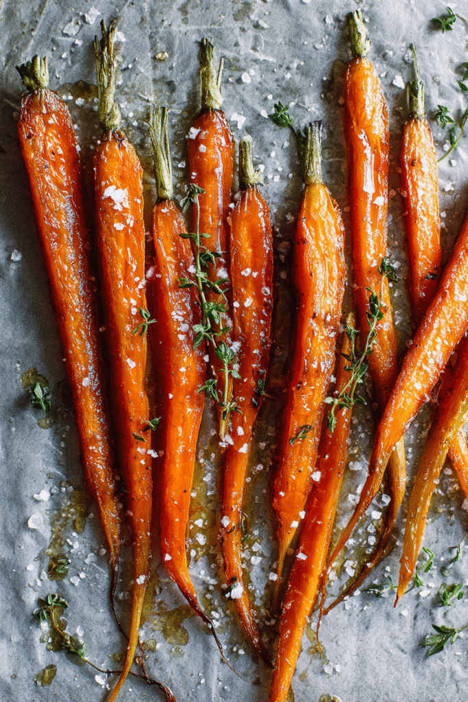 Preparing maple roasted carrots before baking