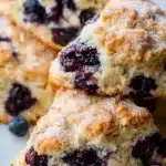 Freshly baked holiday blueberry scones on a cooling rack