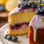 Gluten free lemon cake with blueberry filling on a white plate